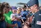 Lt. Col. John Caldwell, commander of the U.S. Air Force Air Demonstration Squadron, signs a toy F-16 Fighting Falcon after the Thunderbirds performance at the Wings Over Wayne Air Show, April 28, 2019, at Seymour Johnson Air Force Base, North Carolina. After the Thunderbirds completed their performance attendees were able to meet the team, as well as receive autographs and take photos together. (U.S. Air Force photo by Airman 1st Class Jacob Derry)