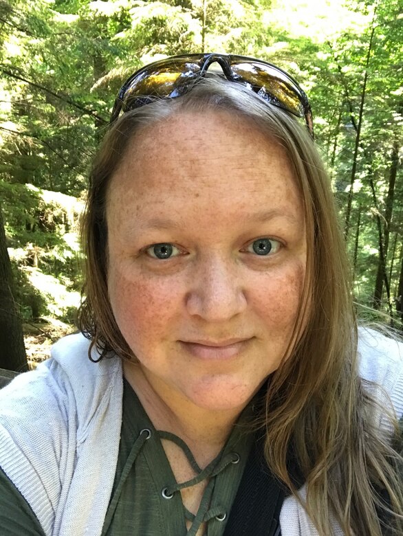 Kim Adkins poses for a selfie while hiking at Capilano Suspension Bridge Park in Vancouver, British Columbia, Canada in 2017.