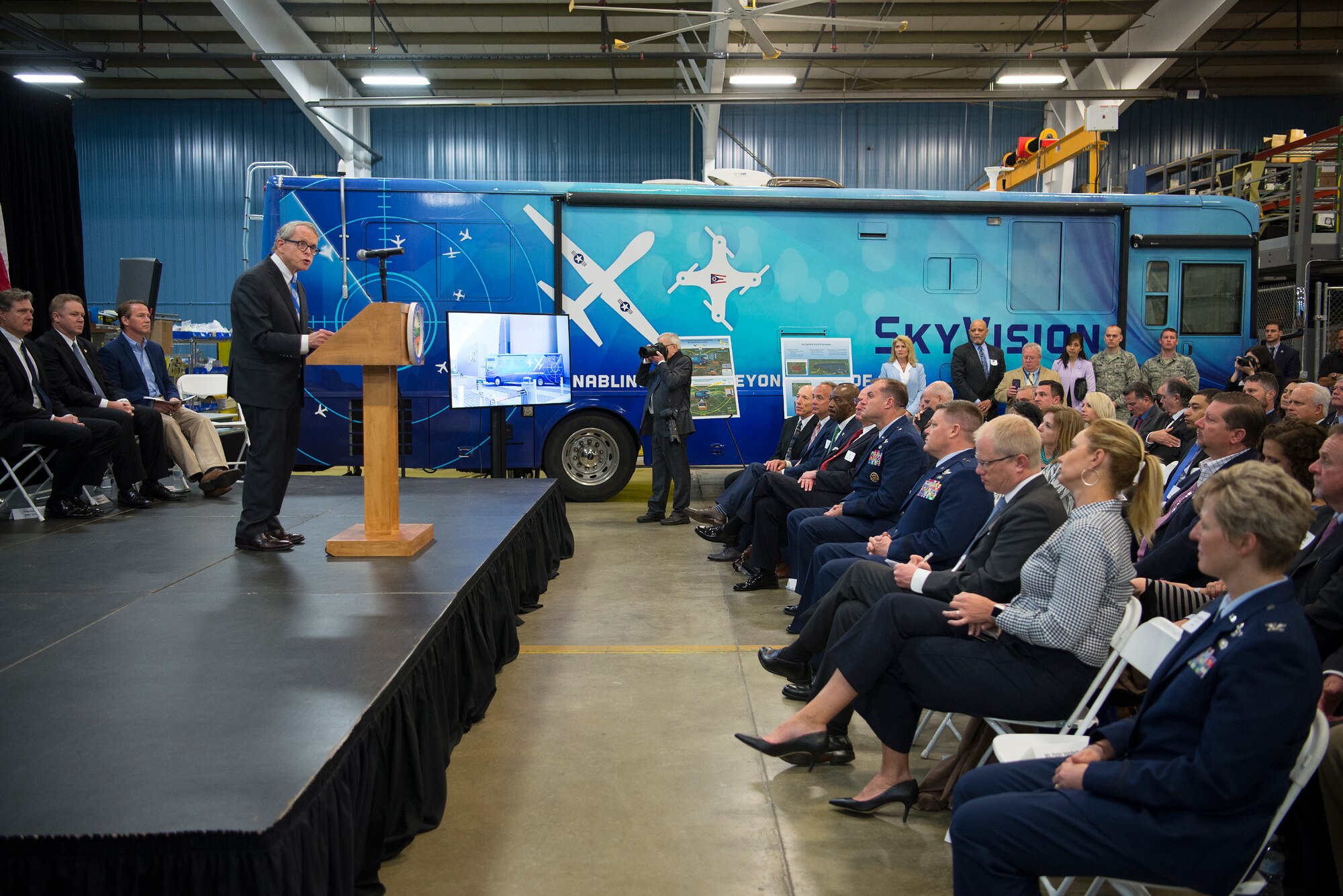 Ohio Governor Mike DeWine addresses those attending the announcement of the Federal Aviation Administration granting a Certificate of Waiver or Authorization to the Air Force Research Laboratory for beyond visual line of sight flights of unmanned aerial systems during an event at the Sprinfield-Beckley Municipal Airport April 26, 2019. (U.S. Air Force photo by R.J. Oriez)