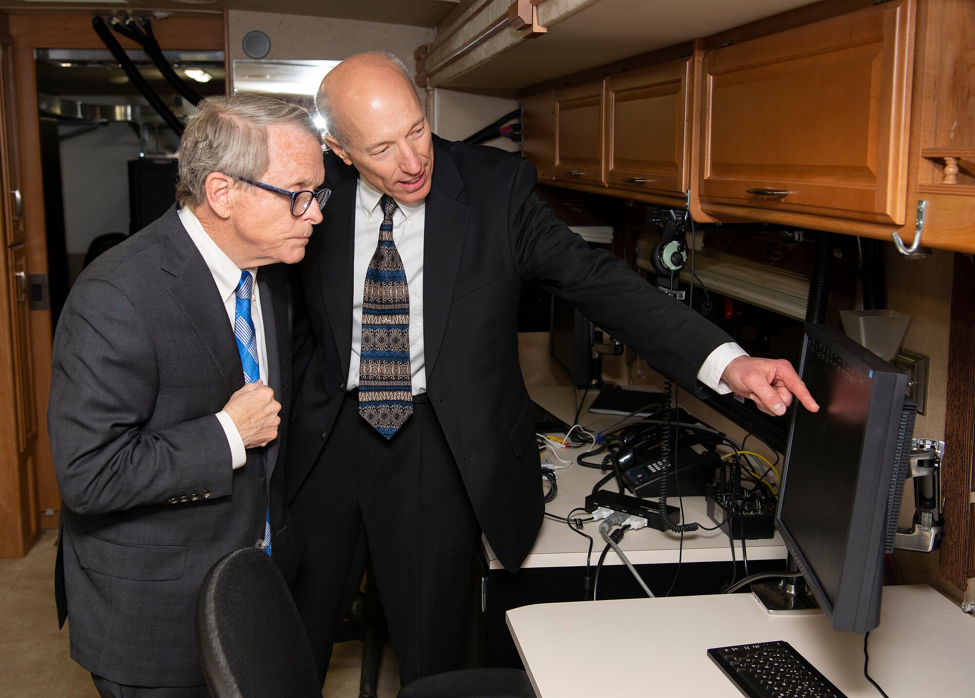 Art Huber, deputy director for operations at the Air Force Research Laboratory, shows Ohio Governor Mike DeWine one of the terminals of the SkyVision system aboard its transportable platform April 19, 2019 in a facility on the Springfield-Beckley Municipal Airport. DeWine was taking part in an announcement about the Federal Aviation Administration granting a Certificate of Waiver or Authorization to AFRL for beyond visual line of sight flights of unmanned aerial systems. (U.S. Air Force photo by R.J. Oriez)