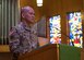 U.S. Army Maj. Lindon Jong, Garrison Chaplain's Office catholic priest, stands at a podium at Joint Base Langley-Eustis, July 31, 2019.