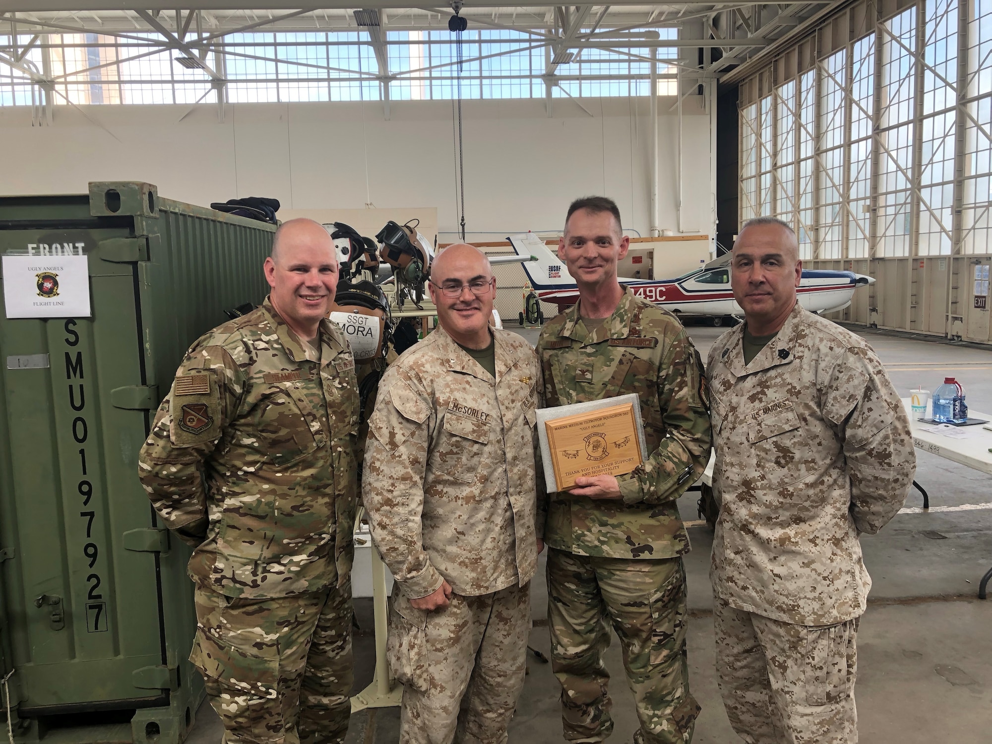 Left to right 377th Air Base Wing Command Chief Master Sgt. Robert Stamper, VMM-362 Commander Lt. Col. Matthew McSorley, 377th ABW Commander Col. David Miller, VMM-361 Sgt. Maj. John Doring