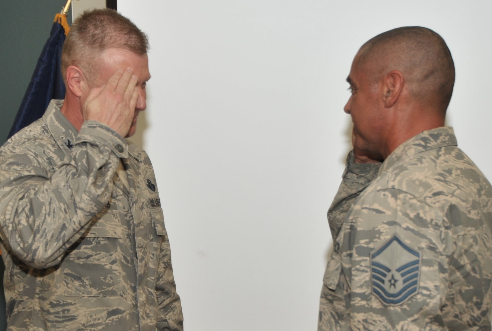 Master Sgt. Michael Hernandez, Reserve military training instructor assigned to the 433rd Training Squadron, Joint Base San Antonio-Lackland, Texas, accepts a commander’s coin - presented for his exceptional performance and influence on thousands of Air Force enlisted trainees - from 340th Flying Training Group Commander Col. Allen Duckworth during the 433rd’s unit training assembly and enlisted summit held at JBSA-Lackland July 23-25.  (U.S. Air Force photo by Debbie Gildea)