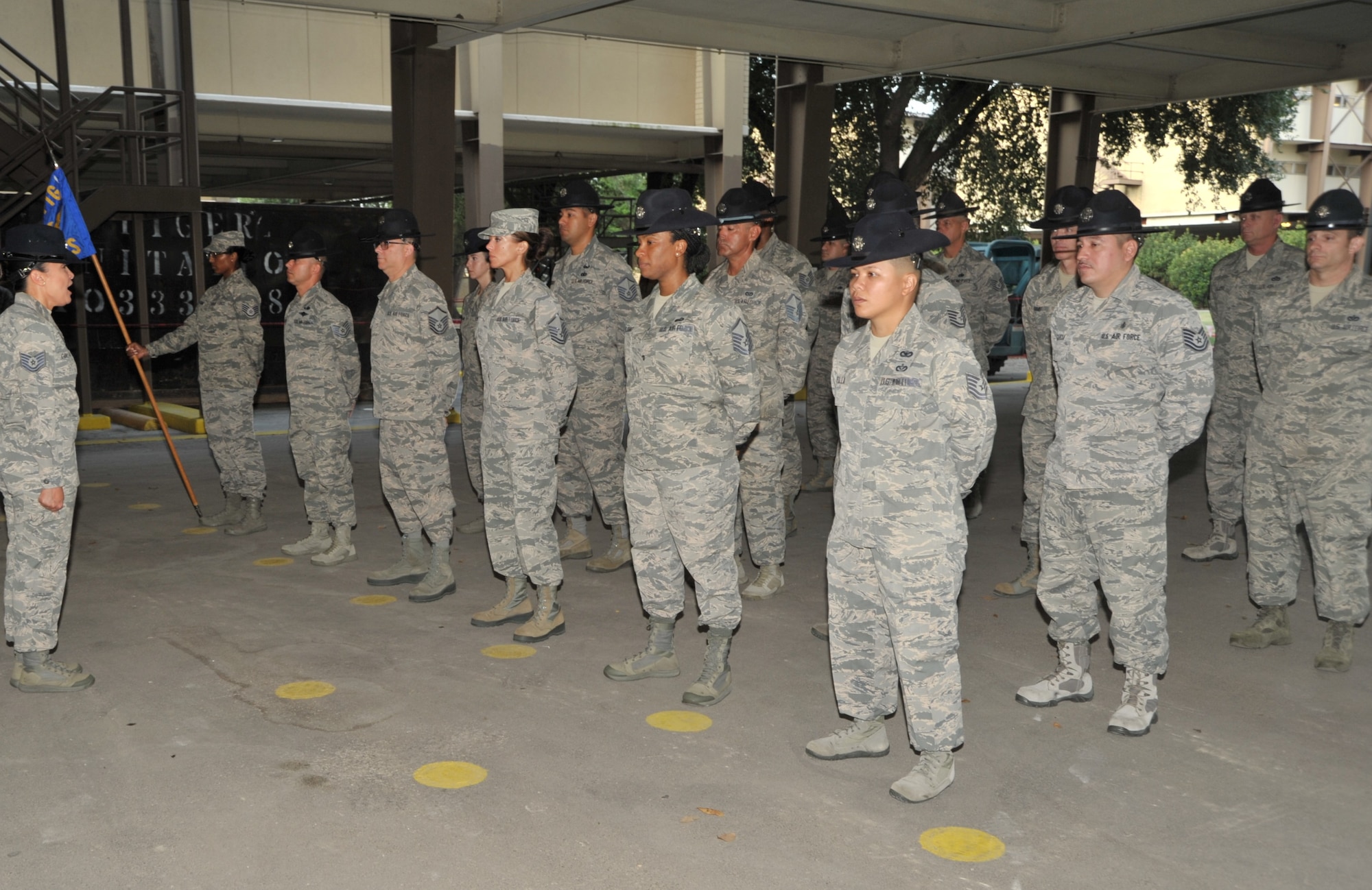 Tech. Sgt. Sharon Collado, Reserve Military Training Instructor, 433rd Training Squadron, Joint Base San Antonio-Lackland, Texas, calls the squadron to attention following open ranks inspection conducted by 340th Flying Training Group Commander Col. Allen Duckworth, during the squadron unit training assembly held at JBSA-Lackland July 23-25. (U.S. Air Force photo by Debbie Gildea)