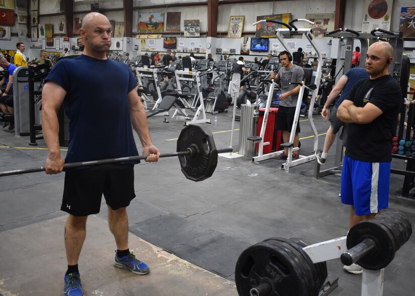 Army Staff Sergeants Robert W. Stephens and Raymond E. Stephens spend time together in the gym while deployed to Camp Arifjan, Kuwait, with the 77th Sustainment Brigade, July 30, 2019.