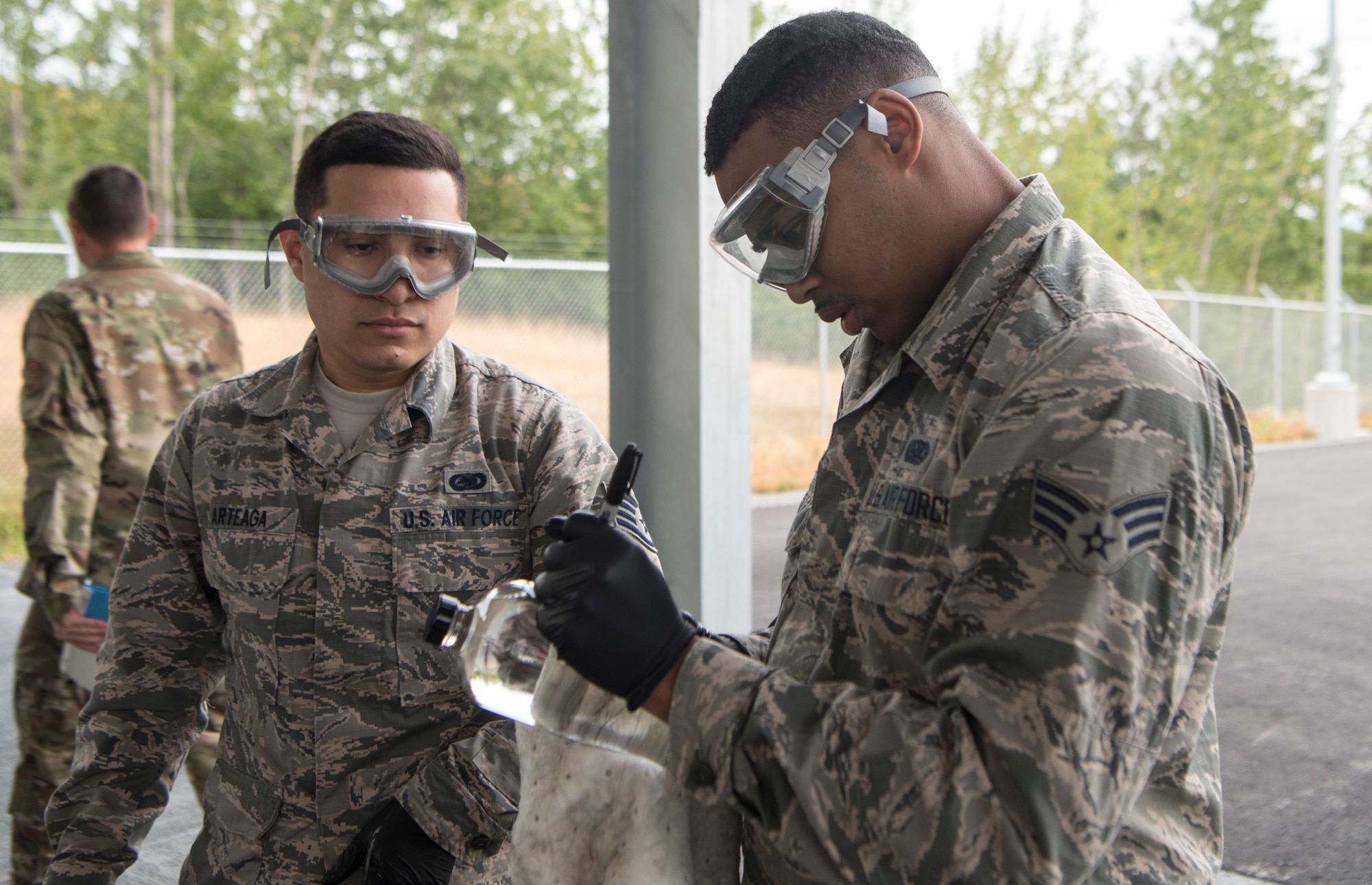 U.S. Air Force Senior Airman Jherron Parks-Harris, a 673d Logistics Readiness Squadron fuels laboratory technician, labels a sample from a tanker truck at a tank truck offload facility on Joint Base Elmendorf-Richardson, Alaska, July 25, 2019. The TTOF became fully operational December 2018, and provides a secondary means to receive JP-8 (Jet Propellant 8) in the event JBER’s fuel pipelines are out of service due to maintenance, damage or natural disaster.