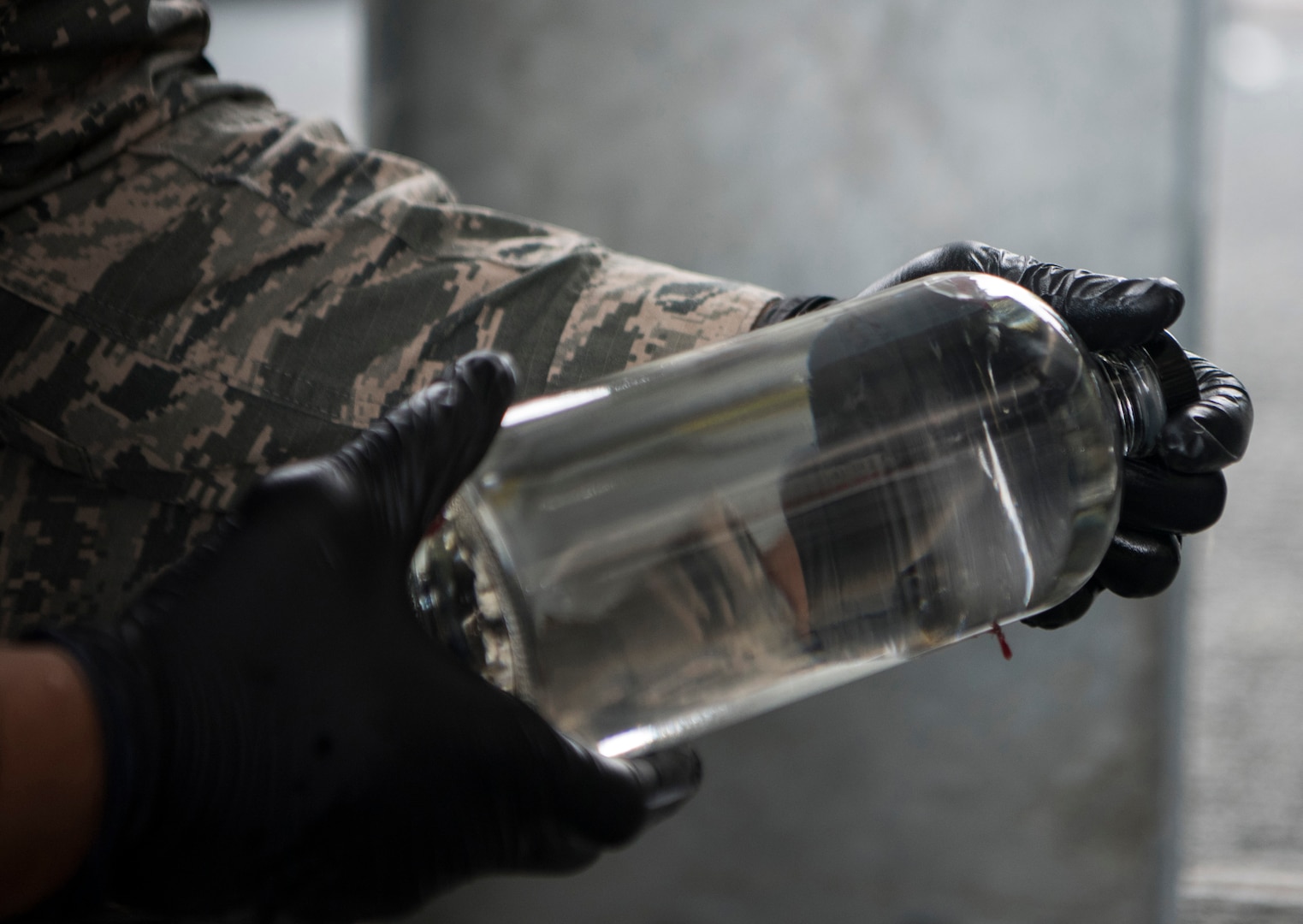 U.S. Air Force Senior Airman Jherron Parks-Harris, a 673d Logistics Readiness Squadron fuels laboratory technician, re-labels a quart jar at a tank truck offload facility on Joint Base Elmendorf-Richardson, Alaska, July 25, 2019. The TTOF became fully operational December 2018, and provides a secondary means to receive JP-8 (Jet Propellant 8) in the event JBER’s fuel pipelines are out of service due to maintenance, damage or natural disaster.