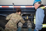 U.S. Air Force Col. Patricia Csànk, 673d Air Base Wing and Joint Base Elmendorf-Richardson commander, pulls a lever at a tank truck offload facility on JBER, Alaska, July 25, 2019. The TTOF became fully operational December 2018, and provides a secondary means to receive JP-8 (Jet Propellant 8) in the event JBER’s fuel pipelines are out of service due to maintenance, damage or natural disaster.