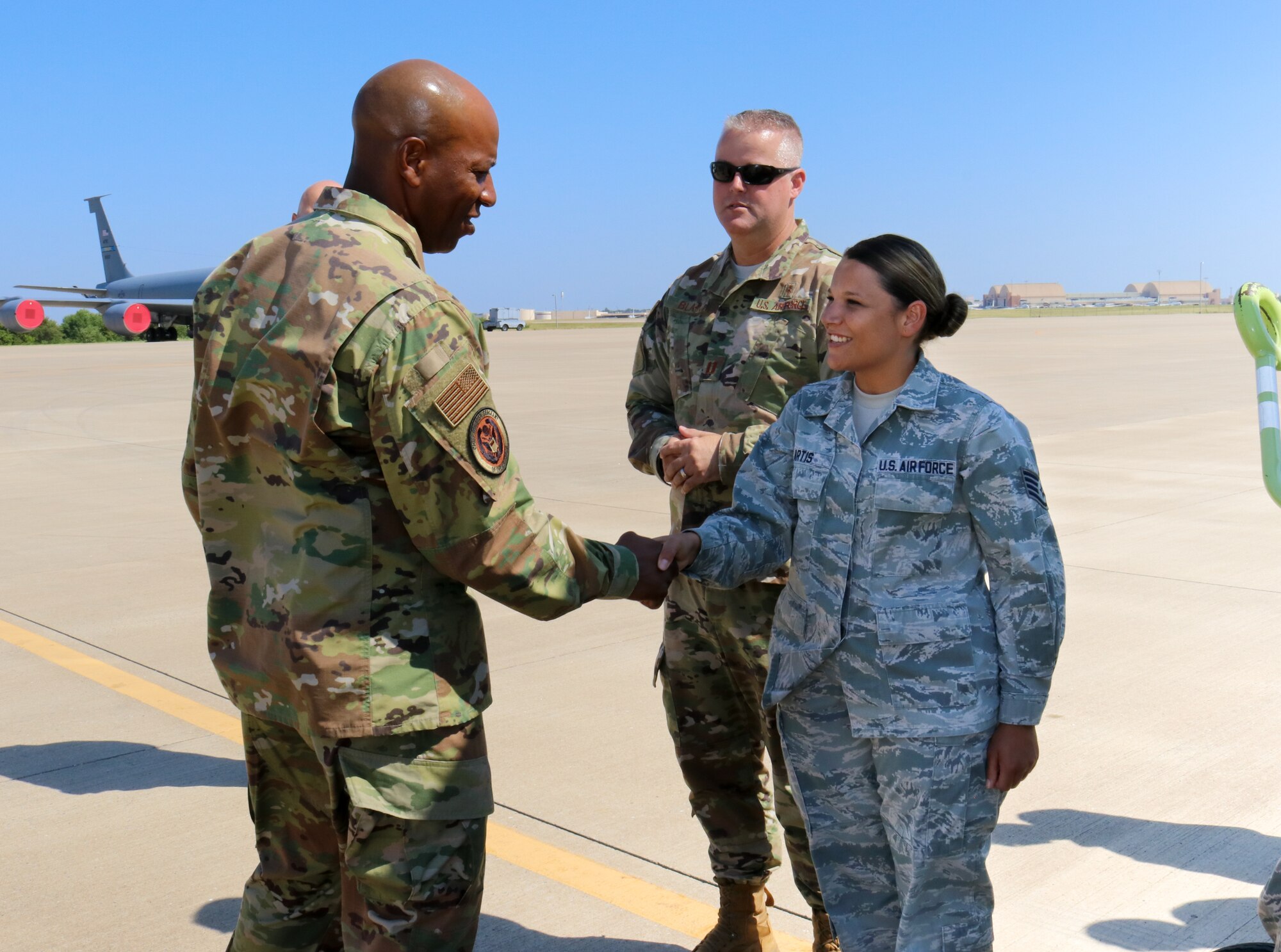 Chief Master Sgt. of the Air Force Kaleth O. Wright coins Staff Sgt. Amber Artis a medical technician for her outstanding performance during his visit to the 507th Air Refueling Wing, Tinker Air Force Base, Oklahoma, July 31, 2019. (U.S. Air Force photo by Senior Airman Mary Begy