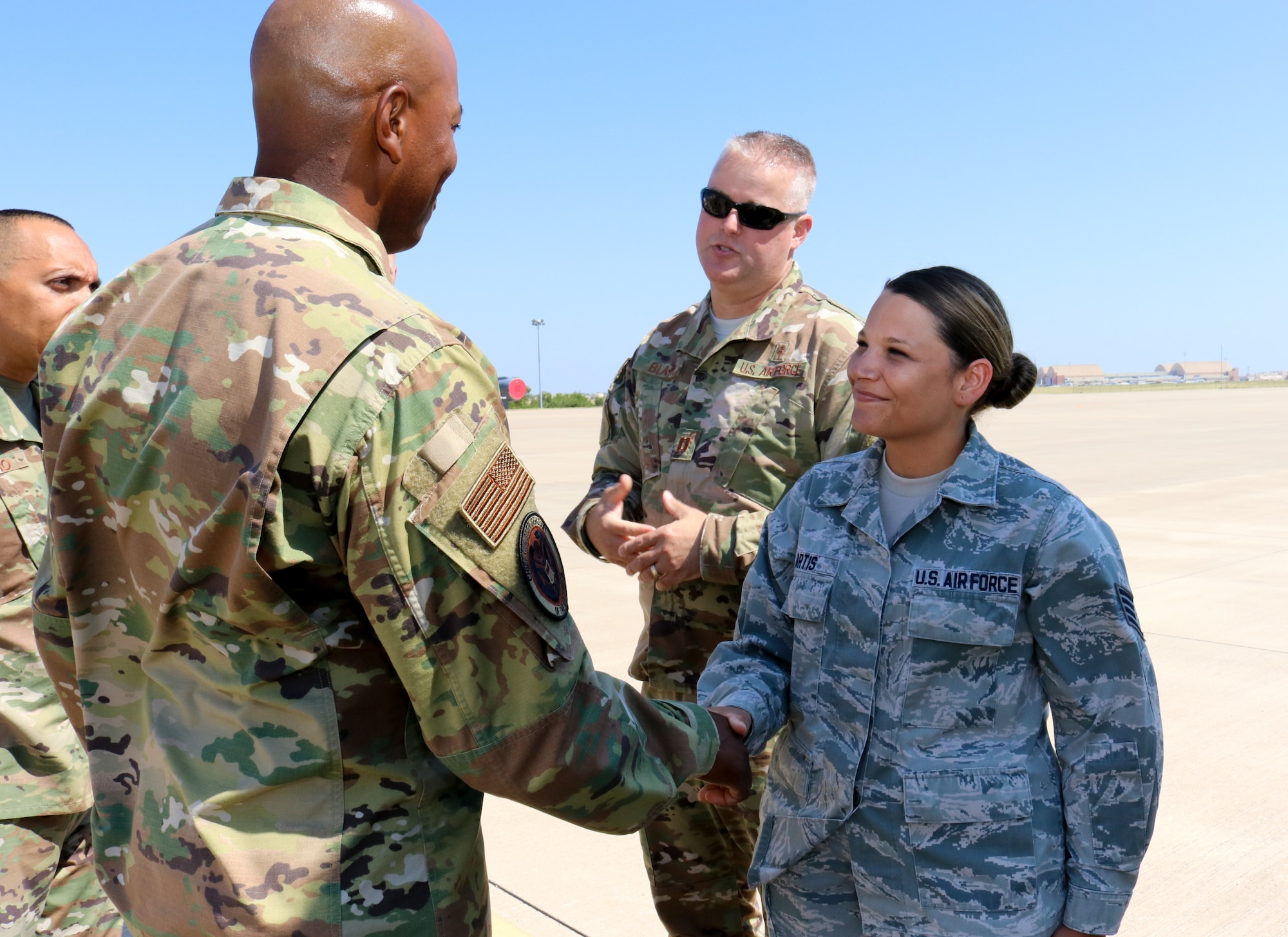 Chief Master Sgt. of the Air Force Kaleth O. Wright coins Staff Sgt. Amber Artis a medical technician for her outstanding performance during his visit to the 507th Air Refueling Wing, Tinker Air Force Base, Oklahoma, July 31, 2019. (U.S. Air Force photo by Senior Airman Mary Begy)