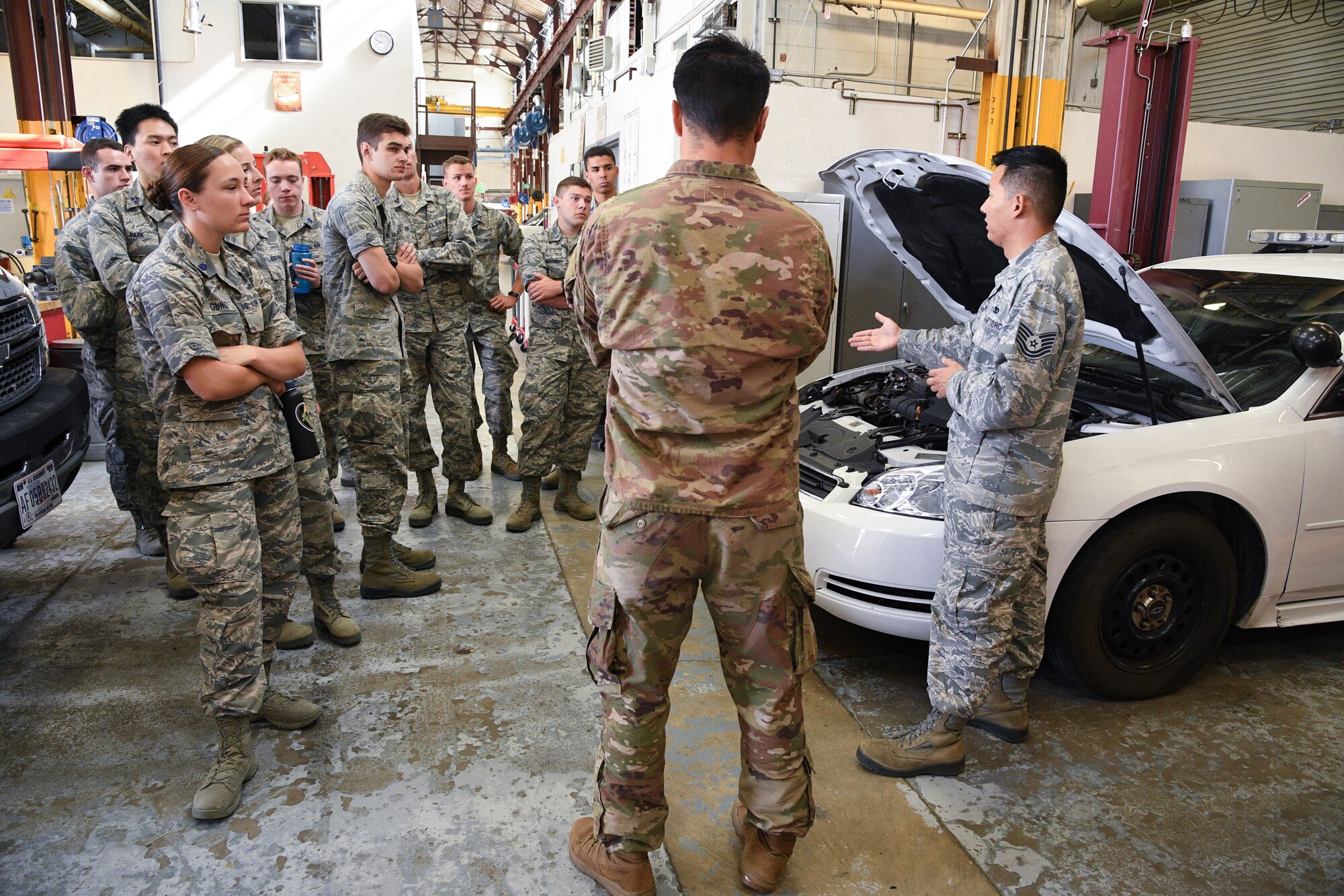 Tech. Sgt. Benjamin Erwin, 75th Logistics Readiness Squadron vehicle maintenance, speaks to Air Force ROTC cadets during a tour of Hill Air Force Base, Utah, July 24, 2019. Over 80 cadets visited Hill as part of a professional development training program called Operation Air Force. The program gives cadets a greater understanding of the Air Force while introducing them to a variety of careers fields. (U.S. Air Force photo by R. Nial Bradshaw)