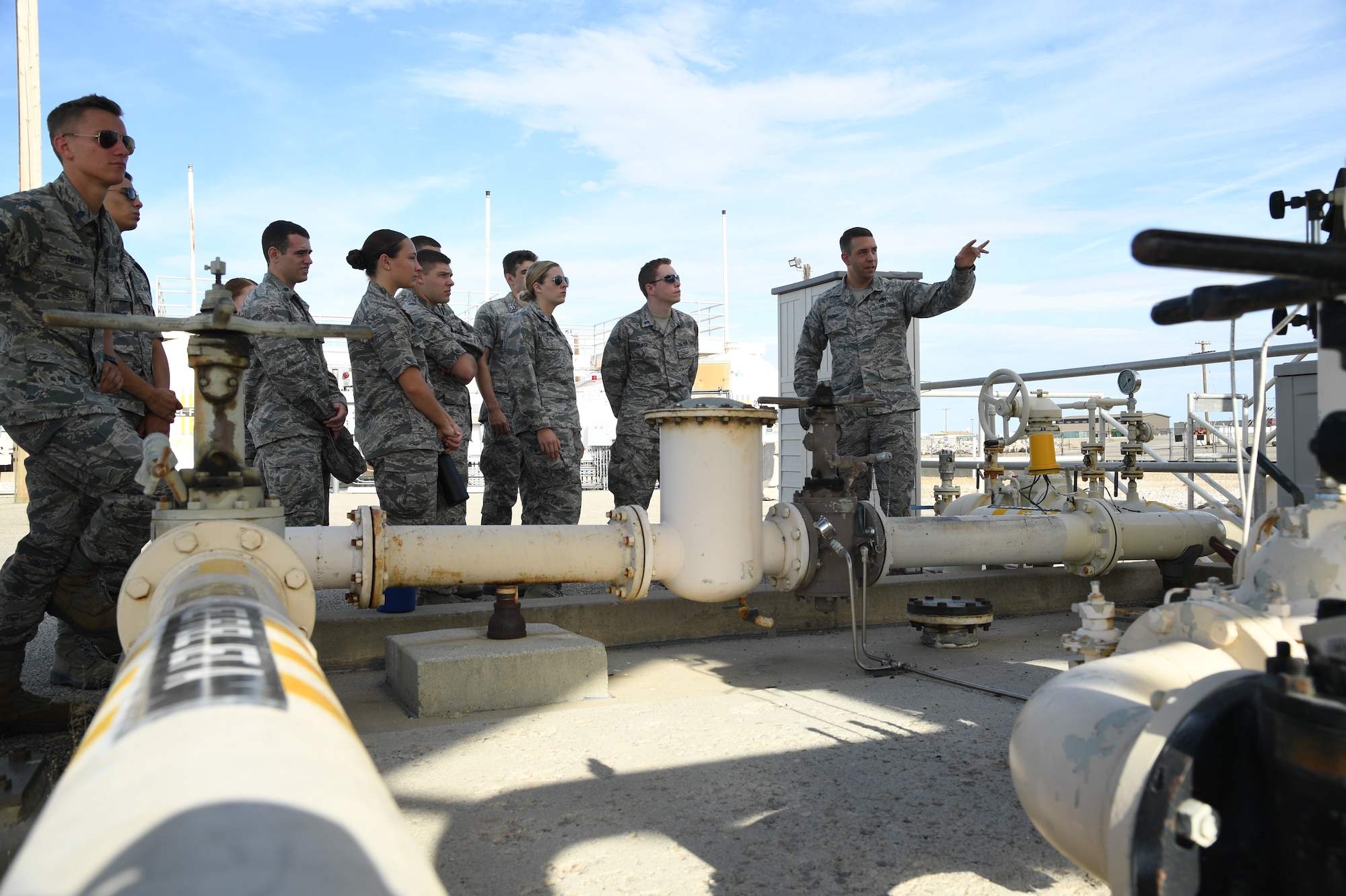 Staff Sgt. James Egger, 75th Logistics Readiness Squadron fuels technician, speaks to Air Force ROTC cadets during a tour of Hill Air Force Base, Utah, July 24, 2019. Over 80 cadets visited Hill as part of a professional development training program called Operation Air Force. The program gives cadets a greater understanding of the Air Force while introducing them to a variety of careers fields. (U.S. Air Force photo by R. Nial Bradshaw)