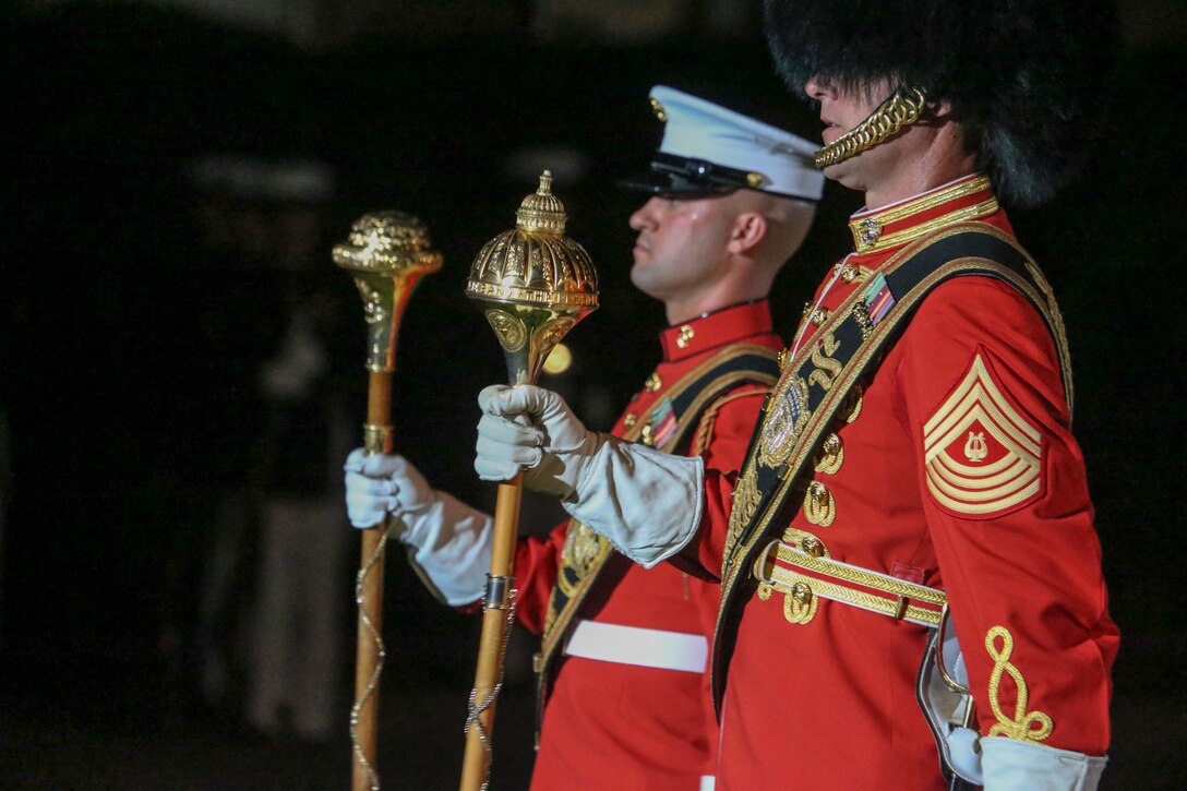 Staff Sgt. David Cox, acting drum major, “The Commandant’s Own” U.S. Marine Drum and Bugle Corps, and MGySgt. Dwayne F. King, drum major, “The President’s Own” U.S. Marine Band, march across the Parade Deck during during the Staff Non-Commissioned Officer Friday Evening Parade at Marine Barracks Washington D.C., July 26, 2019. The hosting official for the evening was Sgt. Maj. Ronald L. Green, 18th Sergeant Major of the Marine Corps, and Troy E. Black, 19th Sergeant Major of the Marine Corps, was the guest of honor. (U.S. Marine Corps photo by Cpl. James Bourgeois)