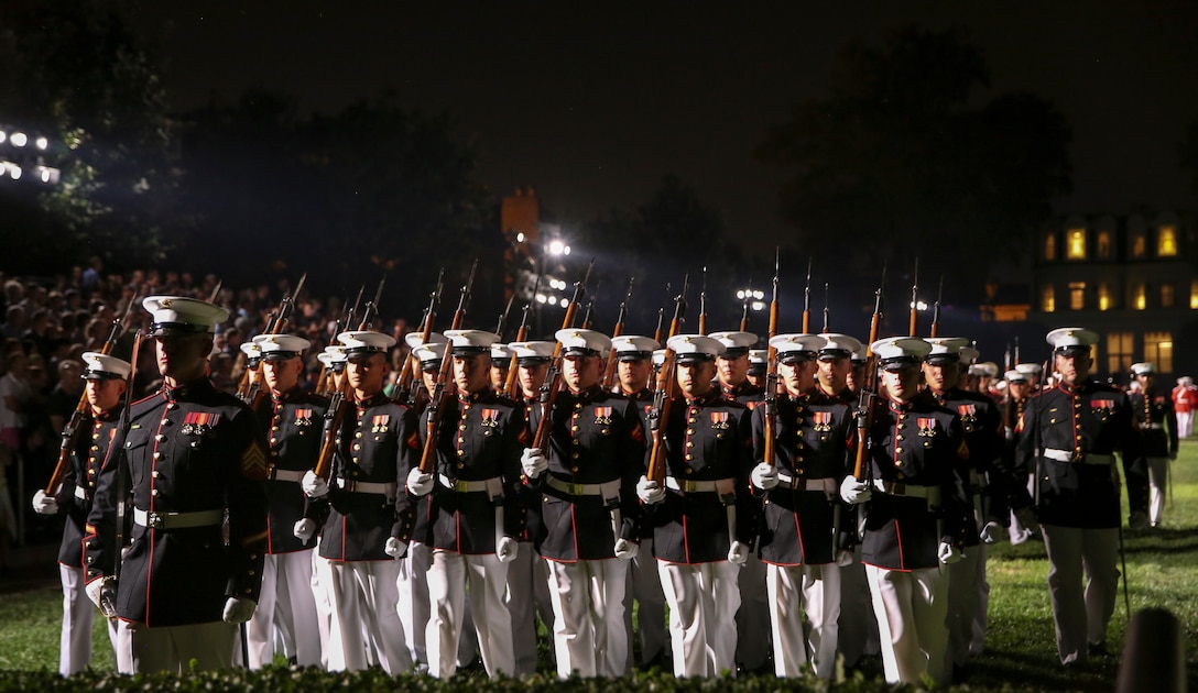 Marines with Alpha Company, Marine Barracks Washington D.C., conduct “pass in review” during the Staff Noncommissioned Officer Friday Evening Parade at Marine Barracks Washington D.C., July 26, 2019. The hosting official for the evening was 18th Sergeant Major of the Marine Corps Sgt. Maj. Ronald L. Green, and Sgt. Maj. Troy E. Black, 19th Sergeant Major of the Marine Corps, was the guest of honor. (U.S. Marine Corps photo by Sgt. Robert Knapp)