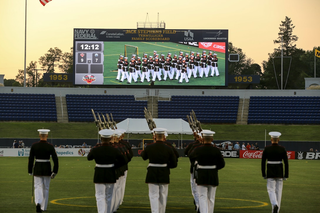 Marines with the U.S. Marine Corps Silent Drill Platoon march onto the field at Navy-Marine Corps Memorial Stadium, Annapolis, Maryland, July 27, 2019. The Silent Drill Platoon performed during halftime at the Major League Lacrosse All Star Game. (U.S. Marine Corps photo by Pfc. Allen Sanders)