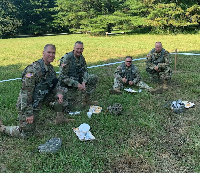 Leaders of the 642nd Aviation Support Battalion and the 42nd Combat Aviation Brigade sample food prepared by the 642nd cooks as part of the Phillip A. Connelly Award Program on July 27, 2019 at Fort Indiantown Gap, Pennsylvania.