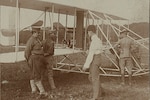 The Wright brothers and some Army Signal Corps soldiers work on the Wright Military Flyer as they test it out at Fort Myer, Virginia, 1909.