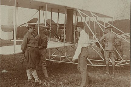The Wright brothers and some Army Signal Corps soldiers work on the Wright Military Flyer as they test it out at Fort Myer, Virginia, 1909.