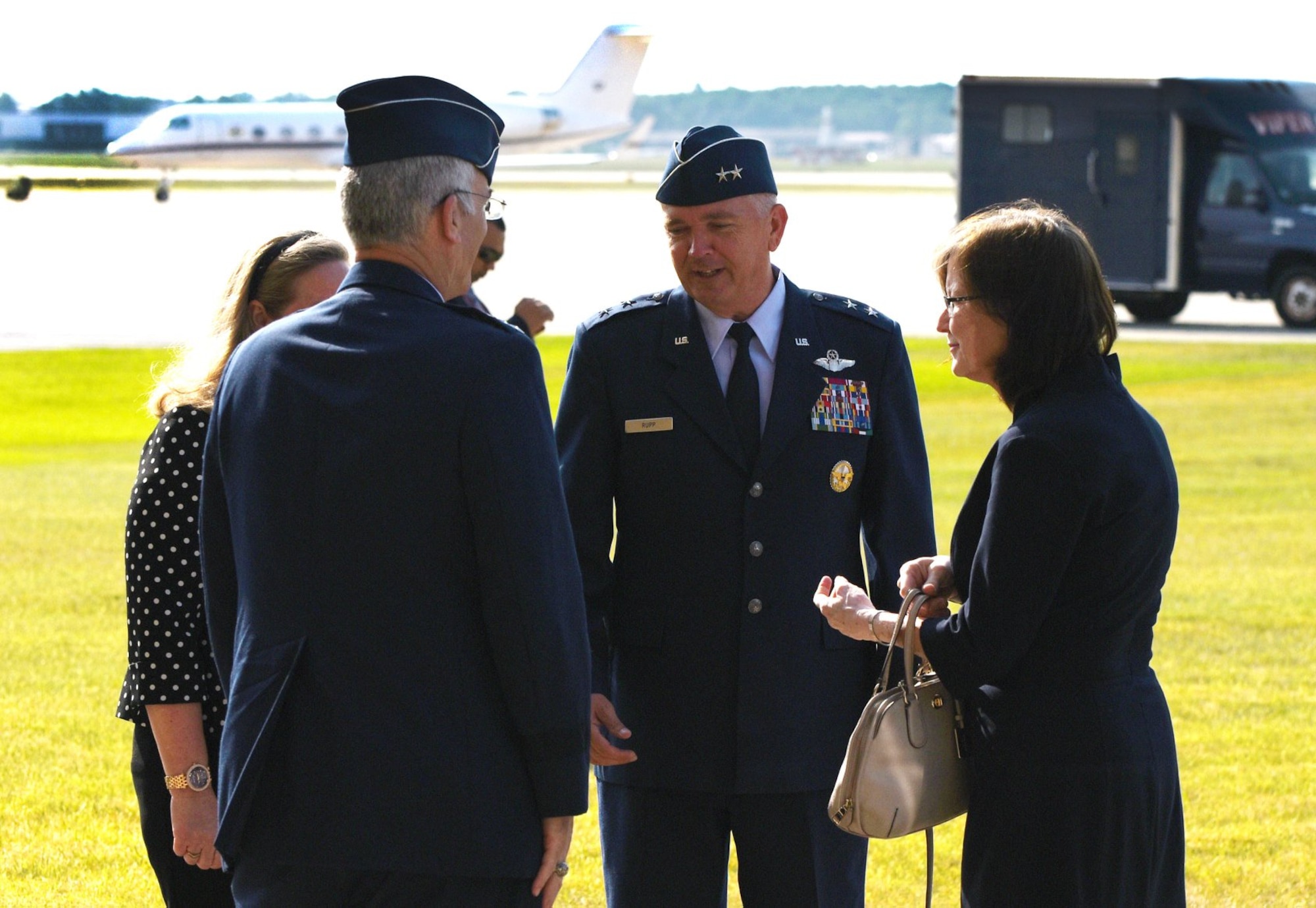 Air Force District of Washington Commander Maj. Gen. Ricky N. Rupp, center, and his wife, Charlotte, left, greet Vice Chairman of the Joint Chiefs of Staff United States Air Force Gen. Paul J. Selva and his wife, Ricki. Selva, who held his retirement ceremony July 31 at Joint Base Andrews Hangar 3, is the 10th Vice Chairman of The Joint Staff. He retires from the Air Force after more than 39 years of honorable service. (U.S. Air Force photo/James E. Lotz)