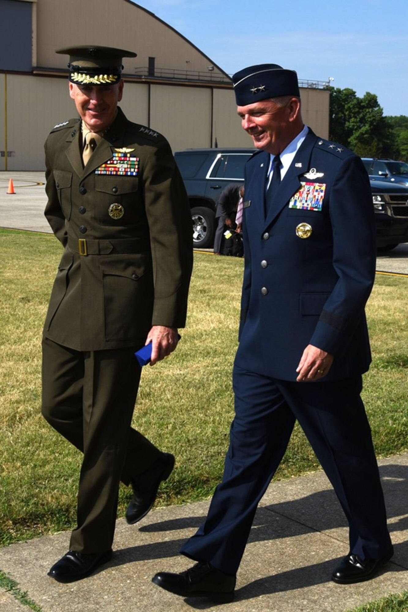 U.S. Marine Corps Gen. Joseph F. Dunford, 19th Chairman of Joint Chiefs of Staff, chats with Air Force District of Washington Commander Maj. Gen. Ricky N. Rupp, as they enter Joint Base Andrews Hangar 3 for the retirement ceremony in honor of Vice Chairman of the Joint Chiefs of Staff Air Force Gen. Paul J. Selva. Selva, the 10th Vice Chairman, retires from the Air Force after more than 39 years of honorable service. (U.S. Air Force photo/Master Sgt. Amaani Lyle)