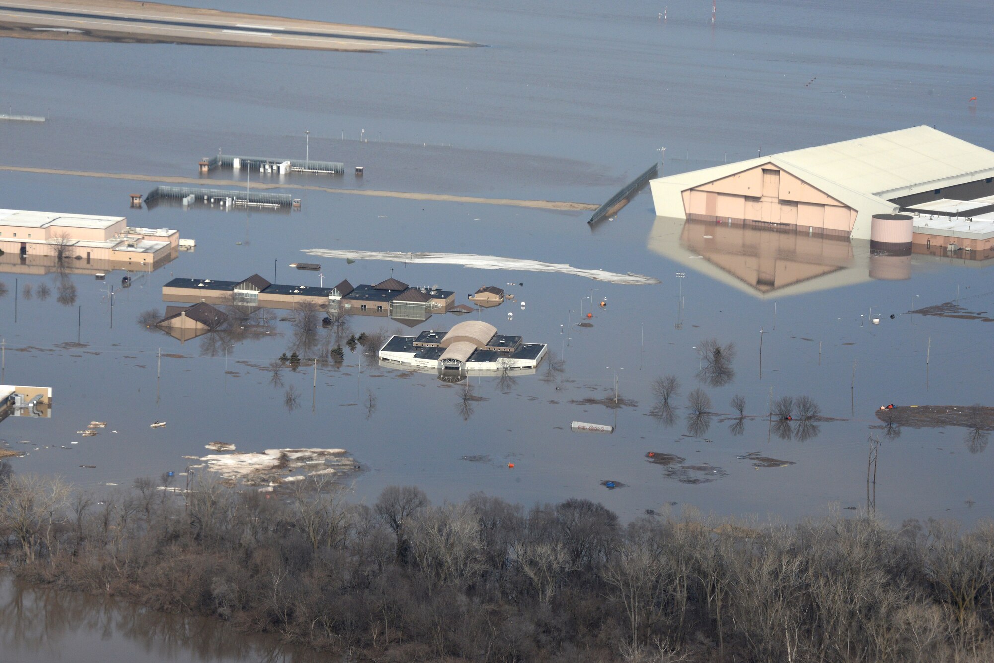 Water covers one-third of Offutt Air Force Base, Nebraska, after the Missouri River flooded in March 2019. AFIMSC cash flowed recovery efforts at Offutt, the October 2018 hurricane at Tyndall AFB, Florida, and the November 2018 earthquake at Joint Base Elmendorf-Richardson, Alaska, in addition to providing funding for border protection at Davis-Monthan AFB, Arizona. (U.S. Air Force photo by Tech. Sgt. Rachelle Blake)