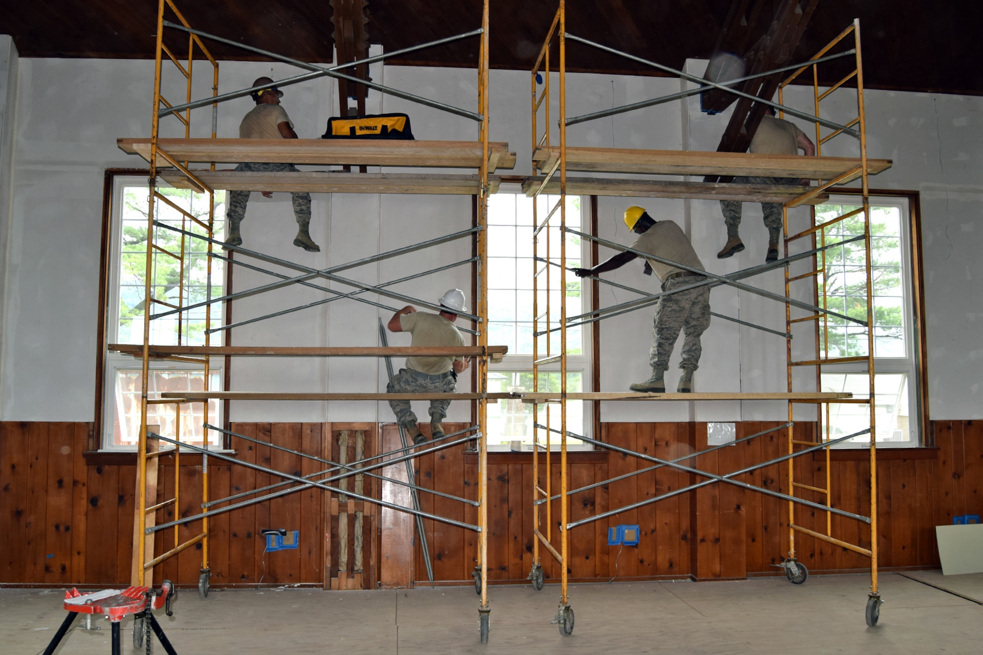 Carpenters of the 127th Civil Engineering Squadron hang and mud drywall during a renovation project at Fort Indiantown Gap National Guard Training Center, Annville, Pennsylvania, on July 22, 2019.
