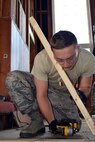 Airman 1st Class Paul Prohaszka, a carpenter with the 127th Civil Engineering Squadron out of Selfridge Air National Guard Base, Michigan,, builds a saw horse during a renovation project at Fort Indiantown Gap, Annville, Pennsylvania, on July 22, 2019.