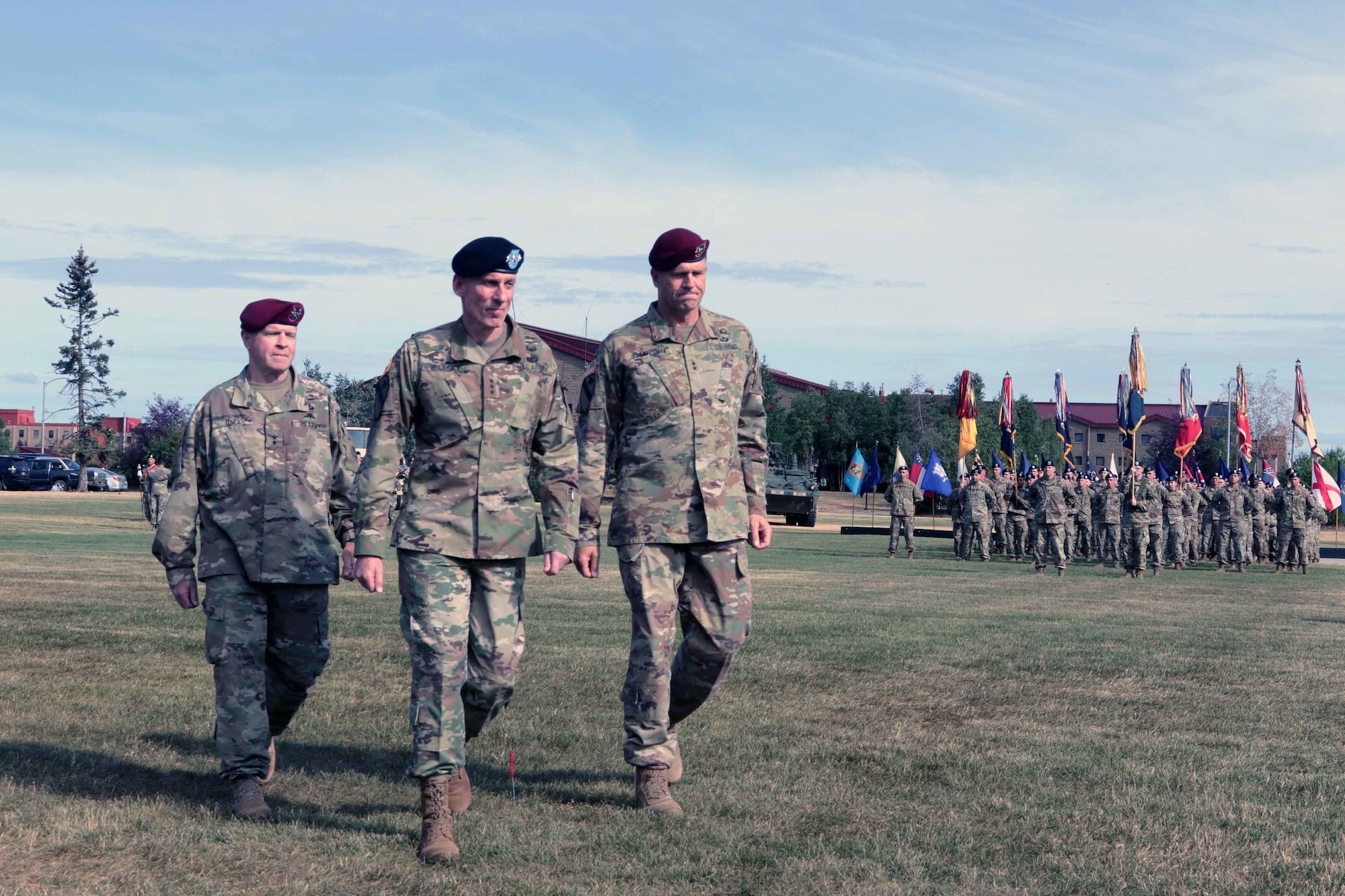 Maj. Gen. O'Neil (left), outgoing U.S. Army Alaska commander, Lt. Gen. Gary Volesky (middle) I Corps and Joint Base Lewis-McChord commander, and Maj. Gen. Peter Andrysiak (right), incoming USARAK commander walk toward the podium after viewing the formation during the USARAK change of command ceremony on Pershing Field July 16.