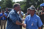 James Geurts (left), assistant secretary of the Navy for research, development and acquisition, congratulates Rod Peterson on a successful Advanced Naval Technology Exercise (ANTX) East in Camp Lejeune, N.C., on July 18, 2019. Peterson is the Marine Corps Vulnerability and Protection Program manager at Naval Surface Warfare Center, Carderock Division and was the technical lead for ANTX East. (U.S. Navy photo by Kelley Stirling/Released)