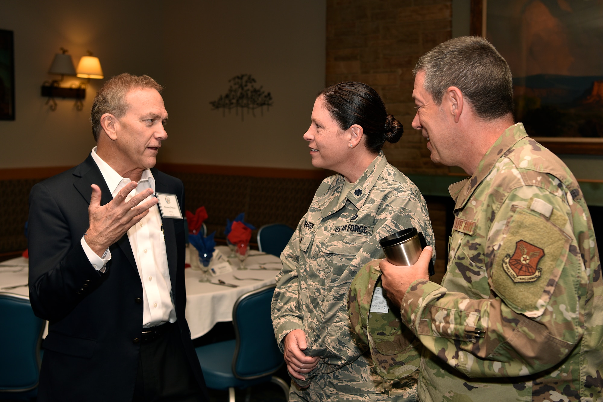 Squadron commanders (right) talk with an honorary commander.