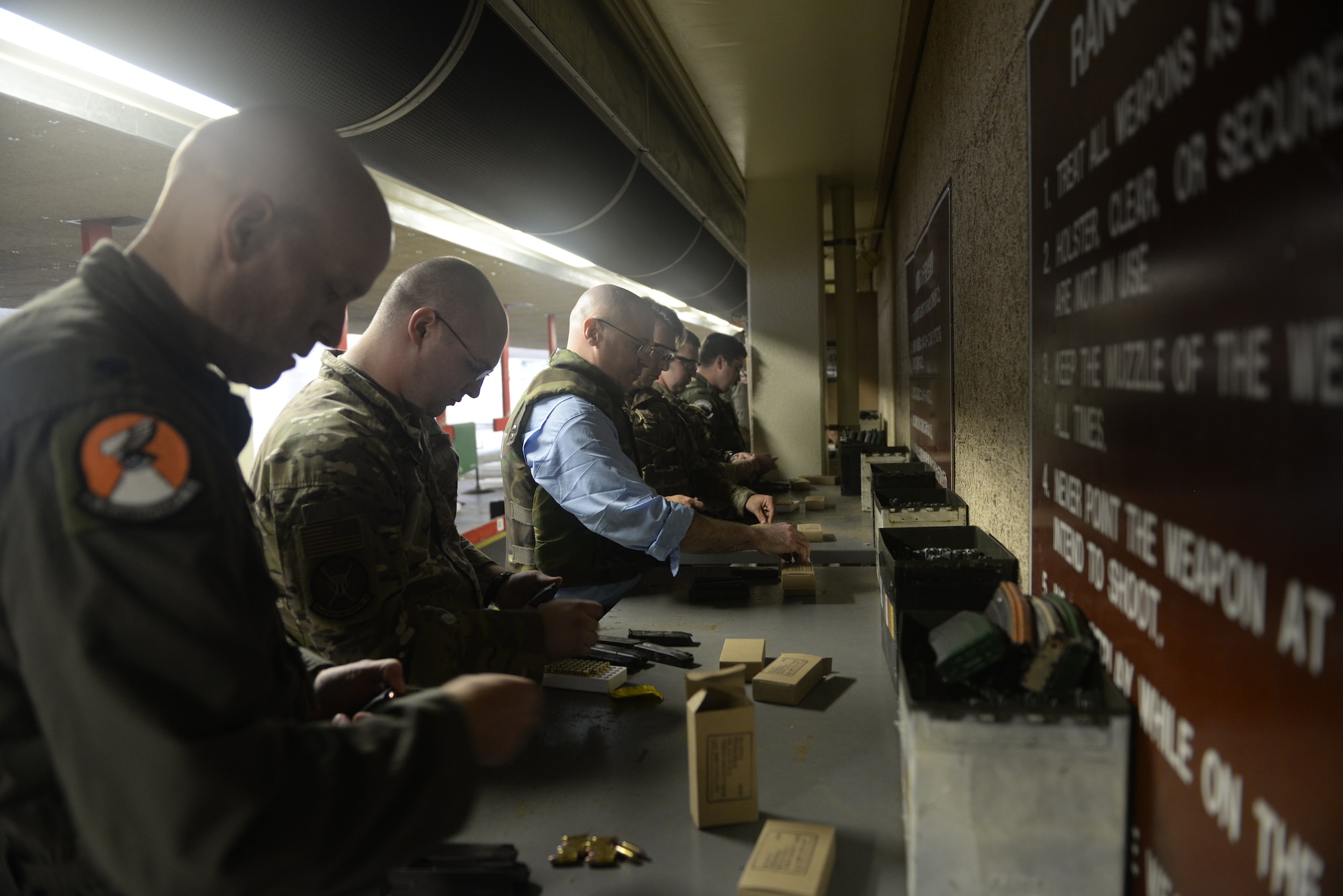 William P. McEvoy, 18th Wing History office chief, loads rouns into the magazine of an M9 pistol during qualification training June 24, 2019, at Kadena Air Base, Japan. McEvoy recently deployed to Southeast asia in support of operations occuring there. (U.S. Air Force photo by Staff Sgt. Benjamin Sutton)