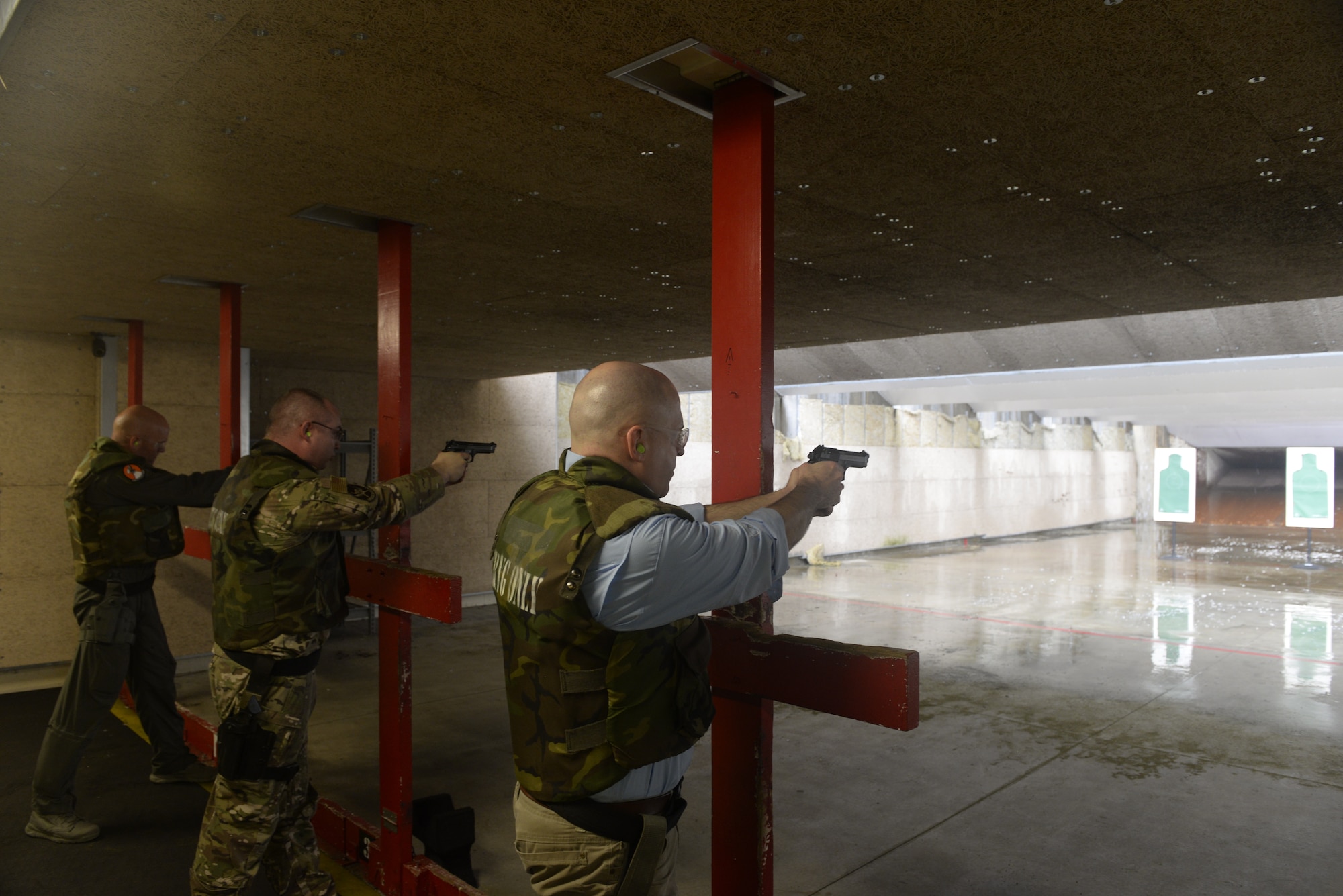 William P. McEvoy, 18th Wing History office chief, fires an M9 pistol during qualification training June 24, 2019, at Kadena Air Base, Japan. McEvoy recently deployed to Southeast asia in support of operations occuring there. (U.S. Air Force photo by Staff Sgt. Benjamin Sutton)