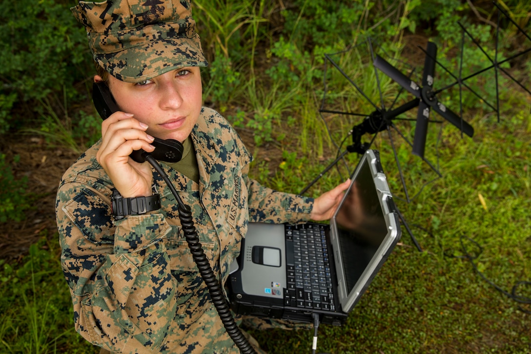 Lance Cpl. Elsa Kalis, an intelligence surveillance and reconnaissance systems engineer with Information Warfare Company, 2nd Radio Battalion, II Marine Expeditionary Force Information Group, poses for a photo at Camp Lejeune, N.C., Aug. 1, 2019. "Telling someone to complete a task isn't leadership; knowing how to do it and showing them is," said Kalis, a Ottawa, Ill., native. According to her leadership, Kalis is an unquestioning professional with unparalleled initiative and unbridled practical reasoning skills. (U.S. Marine Corps photo by Cpl. Austin Livingston)