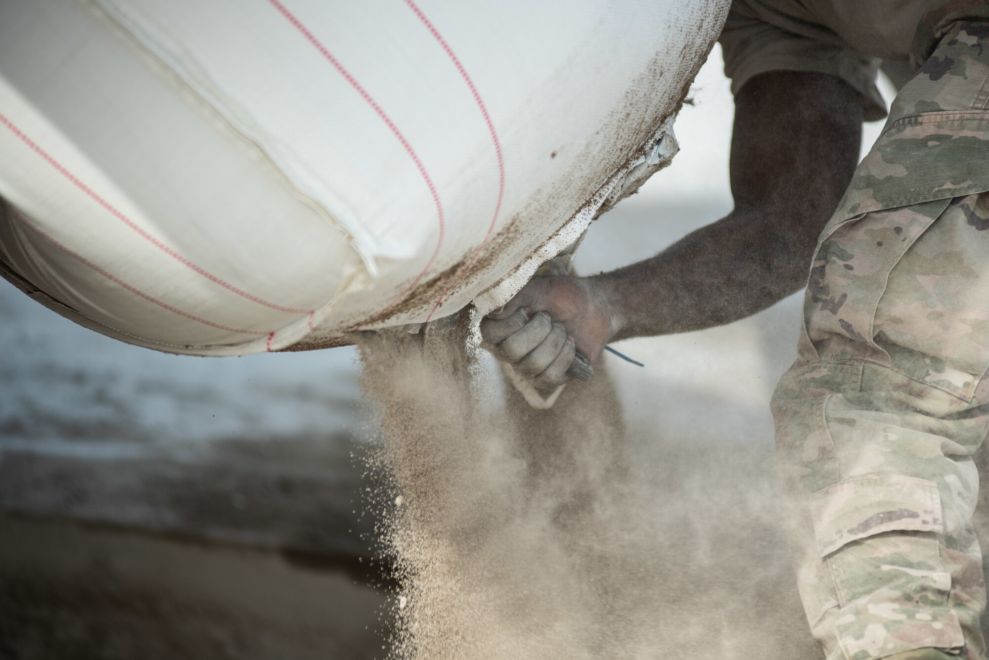 A 380th Expeditionary Civil Engineer Squadron Dirt Boy cuts open a fast-curing concrete package during a rapid airfield damage repair exercise July 26, 2019, at Al Dhafra Air Base, United Arab Emirates. RADR allows aircraft to start utilizing what was once a damaged airfield in a matter of hours compared to days with traditional repair methods. (U.S. Air Force photo by Staff Sgt. Chris Thornbury)