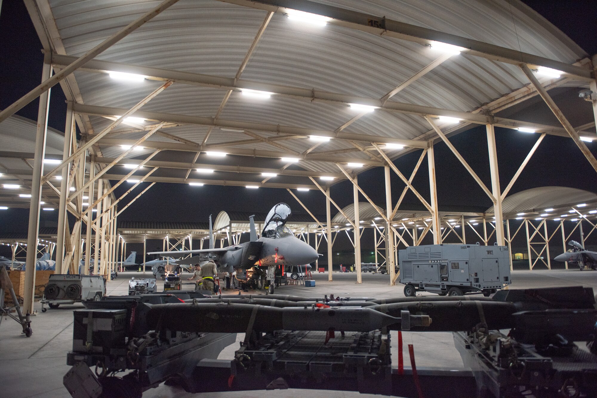 An F-15E Strike Eagle weapons load crew team prepares munitions July 15, 2019, at Al Dhafra Air Base, United Arab Emirates. The various munitions provide the F-15E with diverse response options while conducting combat air patrol missions in support of maritime operations. (U.S. Air Force photo by Staff Sgt. Chris Thornbury)