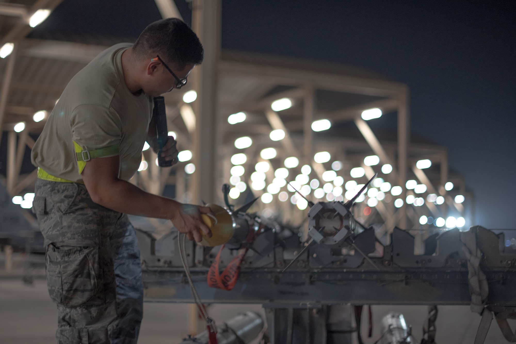 Airman 1st Class Jose Lopez, 380th Expeditionary Aircraft Maintenance Squadron weapons load crew team member, inspects an AIM-9X Sidewinder missile July 15, 2019, at Al Dhafra Air Base, United Arab Emirates. The AIM-9X is an advanced infrared missile and the newest of the Sidewinder family of short-range air-to-air missiles carried on a wide range of fighter jets. (U.S. Air Force photo by Staff Sgt. Chris Thornbury)
