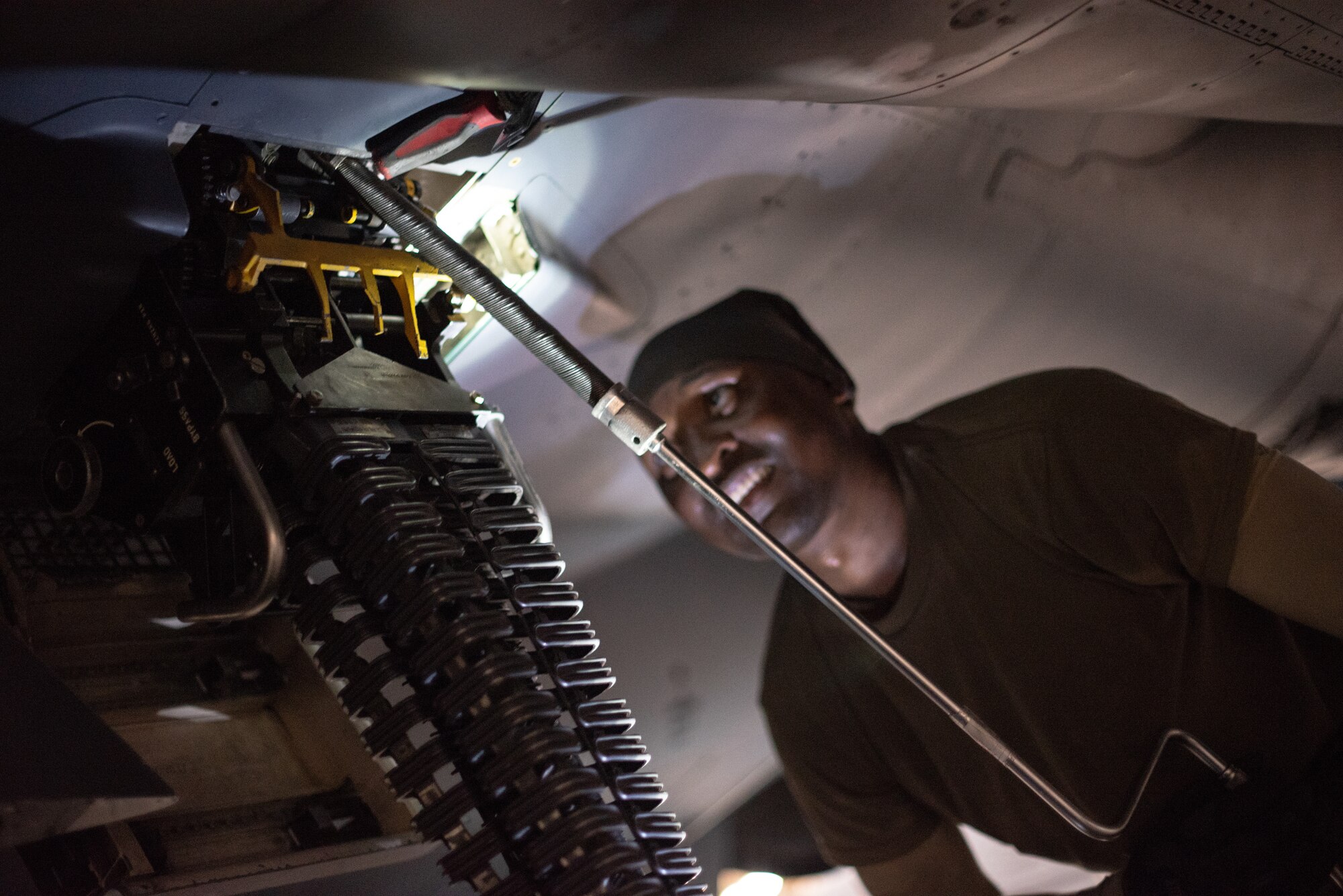 Staff Sgt. Kiefer May, 380th Expeditionary Aircraft Maintenance Squadron weapons load crew team chief, loads an F-15E Strike Eagle with 20mm high-explosive incendiary bullets July 15, 2019, at Al Dhafra Air Base, United Arab Emirates. Weapons load crews work 24/7 operations to support loading and configuring various munitions for the F-35A Lightning II, F-15E Strike Eagle and F-15C Eagle jets at ADAB. (U.S. Air Force photo by Staff Sgt. Chris Thornbury)