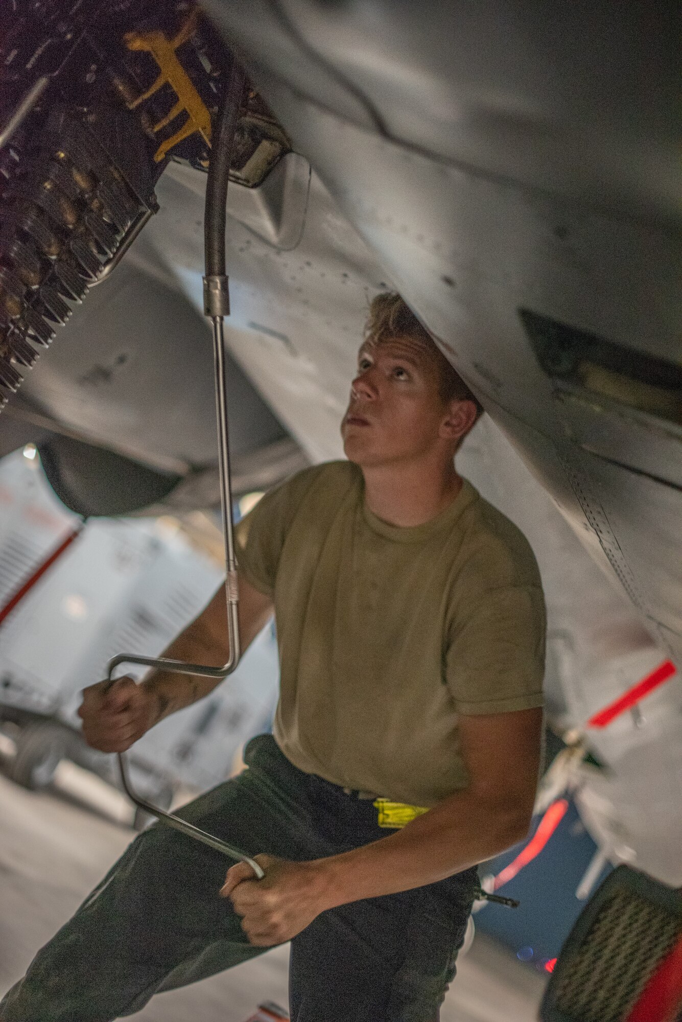 Senior Airman Sean Logan, 380th Expeditionary Aircraft Maintenance Squadron weapons load crew team member, loads an F-15E Strike Eagle with 20mm high-explosive incendiary bullets July 15, 2019, at Al Dhafra Air Base, United Arab Emirates. Weapons load crews work 24/7 operations to support loading and configuring various munitions for the F-35A Lightning II, F-15E Strike Eagle and F-15C Eagle jets at ADAB. (U.S. Air Force photo by Staff Sgt. Chris Thornbury)