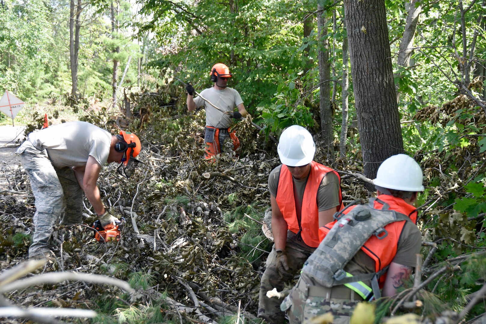 Wisconsin National Guard Soldiers and Airmen help clear storm debris in Barron County, Wis., July 30.