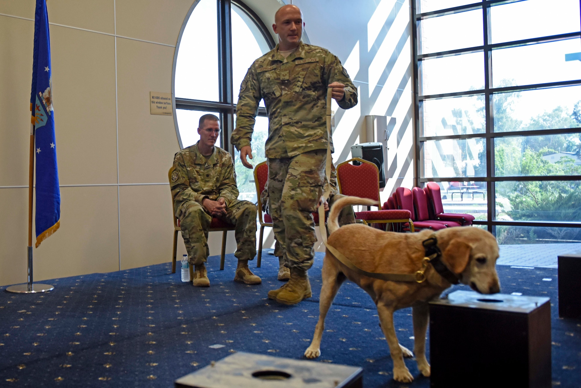 U.S. Air Force Staff Sgt. Nicholas Fletcher, 39th Security Forces Squadron military working dog trainer, conducts a “final sniff” with Autumn, his MWD, during the latter’s retirement ceremony at Incirlik Air Base, Turkey, July 29, 2019. The final sniff is an activity for a retiring working dog in which it detects a hidden object for the last time. (U.S. Air Force photo by Staff Sgt. Joshua Magbanua)