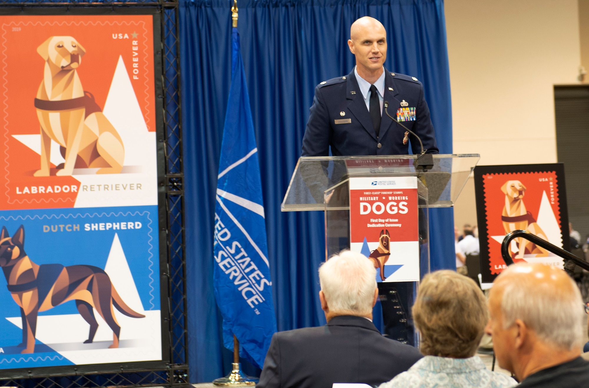 Lt. Col. Michael Cheatham, 55th Security Forces U.S. Air Force Lt. Col. Michael Cheatham, 55th Security Forces Squadron commander, speaks at the unveiling of the Military Working Dog stamp during the American Philatelic Society’s 133rd annual convention Aug. 1, 2019, held at the Catholic Health Initiatives Health Center in Omaha, Nebraska. Cheatham thanked the United States Postal Service for the recognition and immortalizing Military Working Dogs in a widespread public and iconic way. (U.S. Air Force photo by L. Cunningham)Squadron, commander speaks at the unveiling of the Military Working Dog stamp during the American Philatelic Society’s 133rd annual convention Aug. 1, 2019 held at the Catholic Health Initiatives Health Center in Omaha, Nebraska. Cheatham thanked the United States Postal Service for the recognition and immortalizing Military Working Dogs in a widespread public and iconic way. (U.S. photo by L. Cunningham)