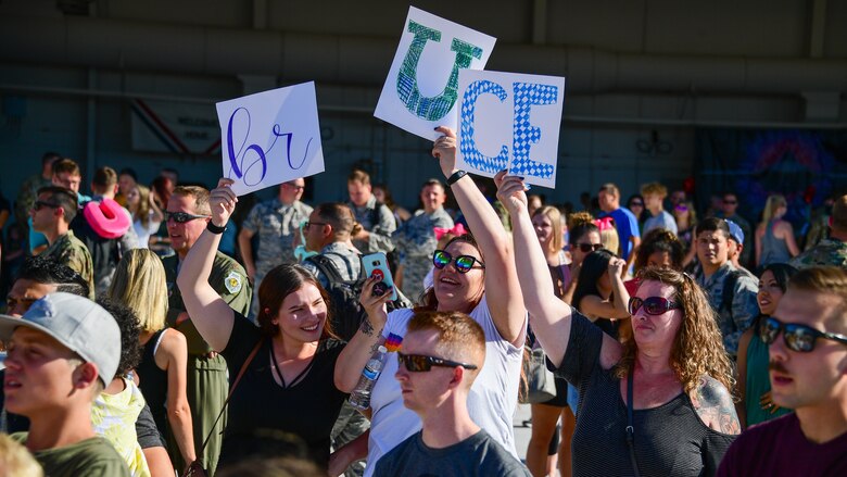 Family and friends await the return of Airmen assigned to the 421st Fighter Squadron at Hill Air Force Base, Utah, July 30, 2019. The Airmen were stationed at Spangdahlem Air Base, Germany, for a 2-month European Theater Security Package. The 421st Fighter Squadron participated in several combat exercises with allied and partner nations while deployed. (U.S. Air Force photo by R. Nial Bradshaw) (U.S. Air Force photo by R. Nial Bradshaw)