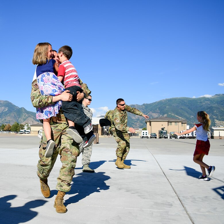 An Airman greets his family during the return of Airmen assigned to the 421st Fighter Squadron at Hill Air Force Base, Utah, July 30, 2019. The Airmen were stationed at Spangdahlem Air Base, Germany, for a 2-month European Theater Security Package. The 421st Fighter Squadron participated in several combat exercises with allied and partner nations while deployed. (U.S. Air Force photo by R. Nial Bradshaw)