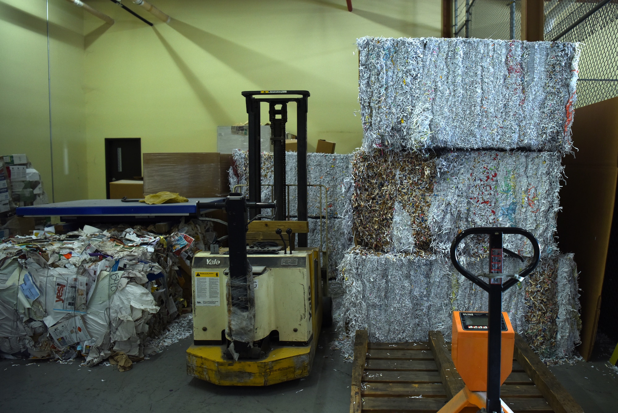 Recyclable materials are organized inside the Recycling Center on Keesler Air Force Base, Mississippi, July 30, 2019. The Qualified Recycling Program reduces the amount of waste going into the landfill and brings money to the base the more items are recycled. (U.S. Air Force photo by Senior Airman Suzie Plotnikov)