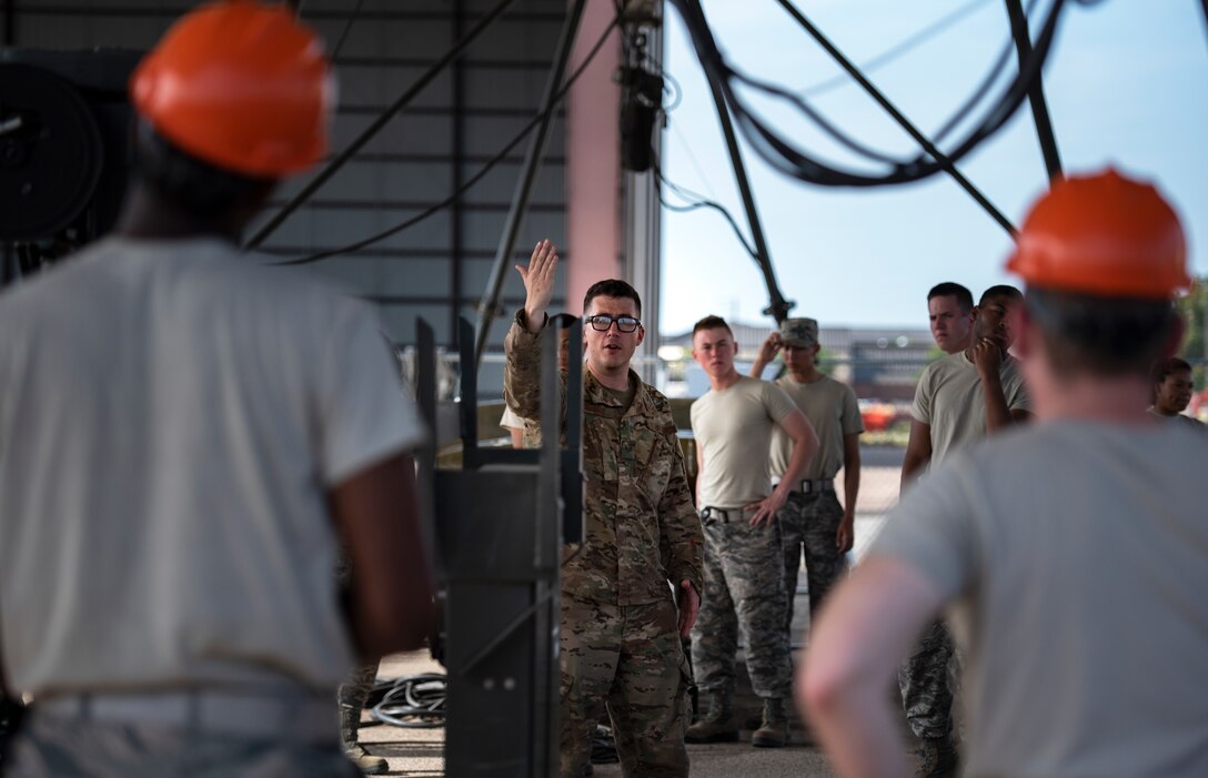 363rd Training Squadron munitions apprentice course students listen to their instructor at Sheppard Air Force Base, Texas, August 1, 2019. The munitions course is 43 days of training. In this time the students are taught how to handle, inspect and assemble bombs and other weapons. They work with all the safety precautions and gear as if really working with live munitions, as to get the students comfortable with working around dangerous objects. (U.S. Air Force photo by Air Force photo by Airman 1st Class Pedro Tenorio)