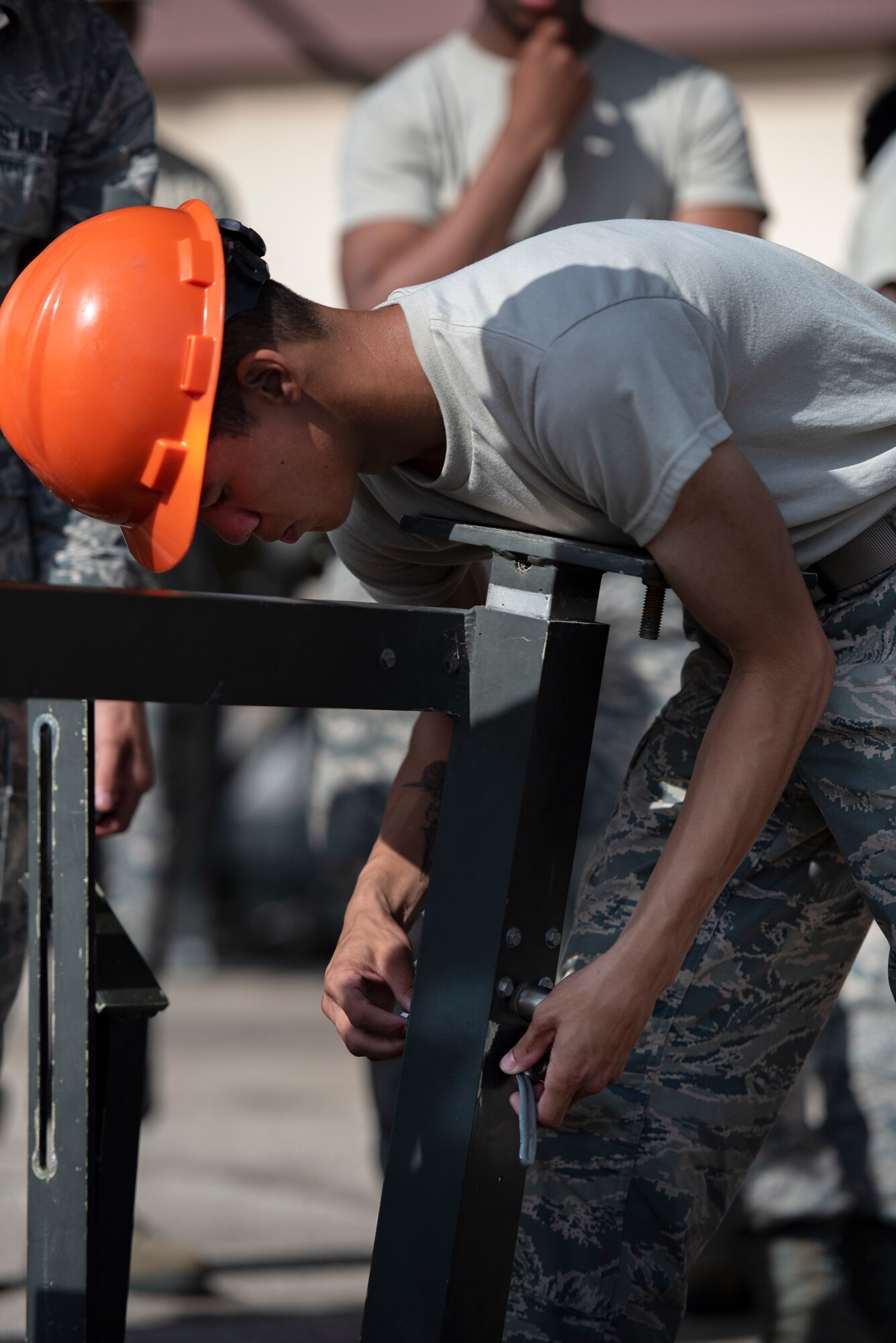 A 363rd Training Squadron munitions apprentice course assembles a munitions assembly conveyor at Sheppard Air Force Base, Texas, August 1, 2019. The MAC is used as a mobile assembly line making it easier to move and adjust munitions in a controlled environment. (U.S. Air Force photo by Air Force photo by Airman 1st Class Pedro Tenorio)