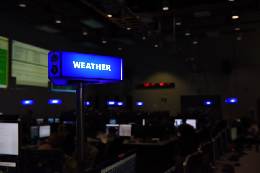 Lt. Col. “Spaz” Sposito-Salceies, 505th Test Squadron (TS) commander, stands behind her desk July 26, 2019, at Nellis Air Force Base, Nev.