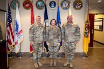 Joint Task Force Civil Support (JTF-CS) Commanding General Army Maj. Gen. William “Bill” Hall, U.S. Army North (ARNORTH) Commanding General Army Lt. Gen. Laura Richardson and JTF-CS Command Senior Enlisted Leader Chief Master Sgt. James Brown pose for a photo inside JTF-CS headquarters. During the visit, which is her first since assuming command of ARNORTH, Richardson toured the facility to learn about the command’s capabilities and mission and received an operations brief with the command’s leadership. (Official DoD photo by Mass Communication Specialist 3rd Class Michael Redd/RELEASED)