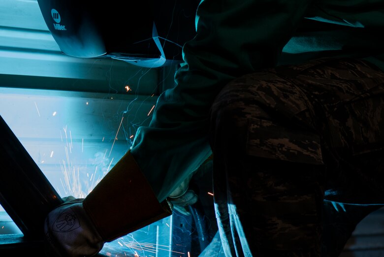 U.S. Air Force Airman 1st Class Dakota Montgomery, 20th Equipment Maintenance Squadron aircraft metals technology apprentice, uses a plasma cutter on a transport cart at Shaw Air Force Base, South Carolina, July 30, 2019.