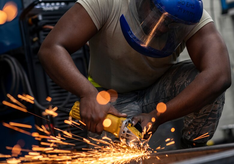 .S. Air Force Airman 1st Class Tylique McMichael, 20th Equipment Maintenance Squadron aircraft metals technology apprentice, grinds the support platform to a transfer cart at Shaw Air Force Base, South Carolina, July 30, 2019.